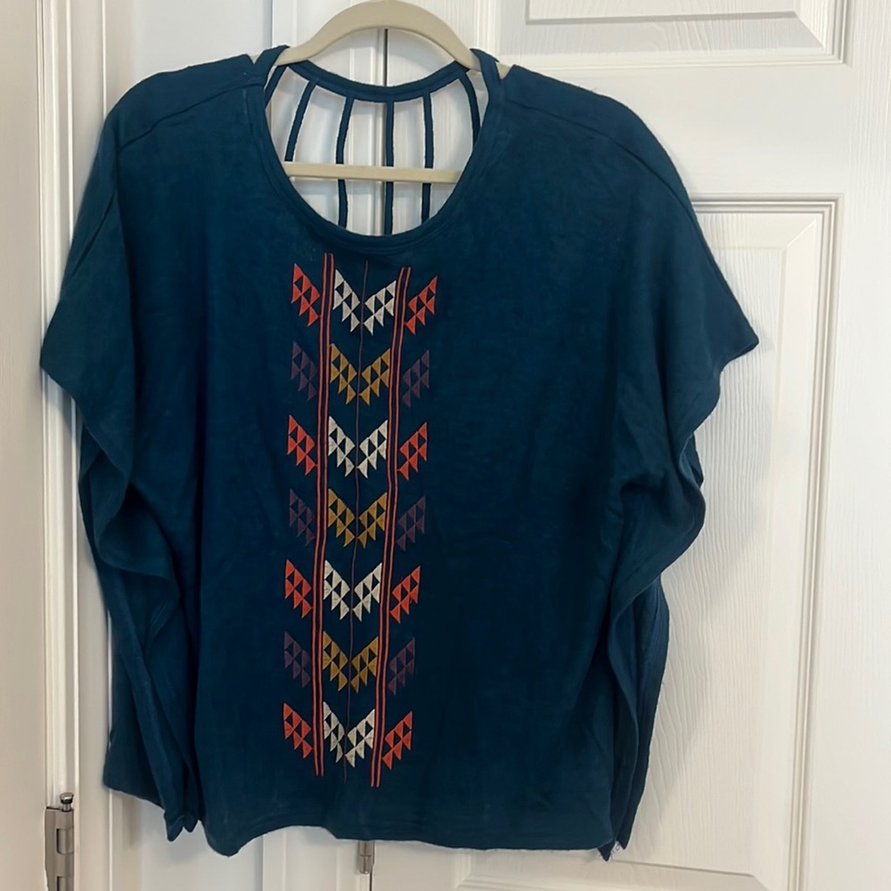 Aztec print teal blue short sleeve shift sweater top with high back cutouts